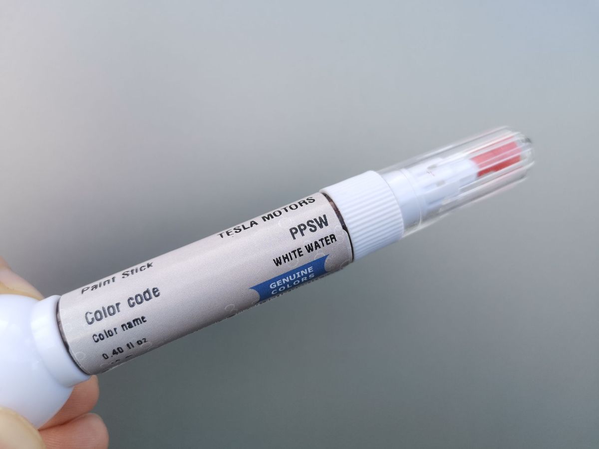 A Genuine Colors pen with the car maker, color code and color name on the label